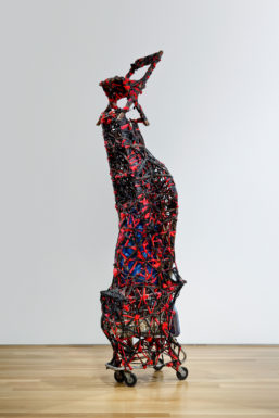 Nari WardSavior, 1996Shopping cart, plastic garbage bags, cloth,bottles, metal fence, earth, wheel, mirror, chair, and clocks128 x 36 x 23 inches (325.1 × 91.4 × 81.3 cm)Collection of Jennifer McSweeneyCourtesy the artist and Lehmann Maupin, New York and Hong Kong. Photo byEG Schempf. Courtesy Nerman Museum of Contemporary Art© 2017Nari Ward